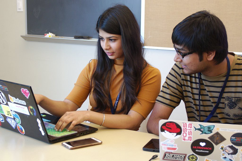 Urvika Gola, former Outreachy intern, hacks on the open source Android application, Lumicall, with former Google Summer of Code intern, Pranav Jain.